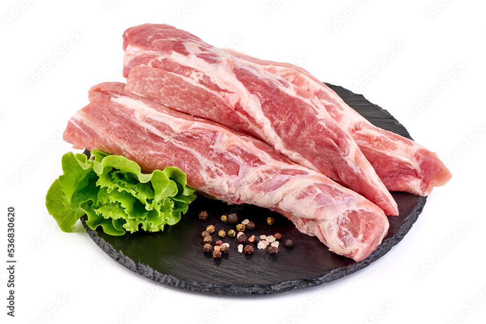 Pork fillet tenderloin with lettuce, raw meat, close-up, isolated on white background.