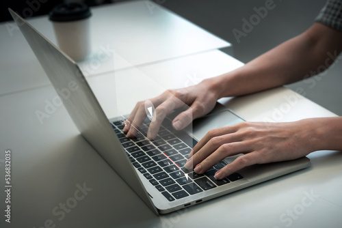 Hands of a businesswoman surfing the web and viewing a video