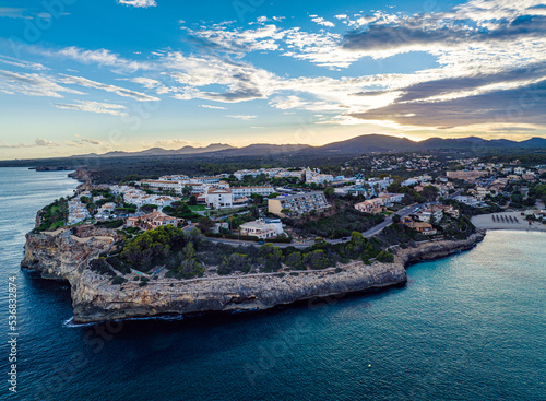 Fototapeta Naklejka Na Ścianę i Meble -  Sunset over Cala Anguila-Cala Mendia from a drone, Porto Cristo, Majorca, Spain, Europe