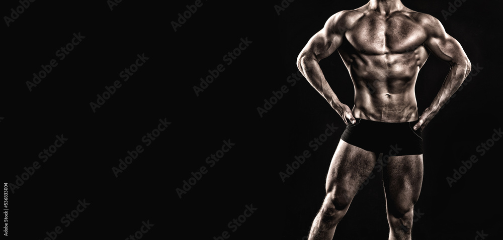 bodybuilding pose of muscular bodybuilder. bodybuilder in bodybuilding pose isolated on black.