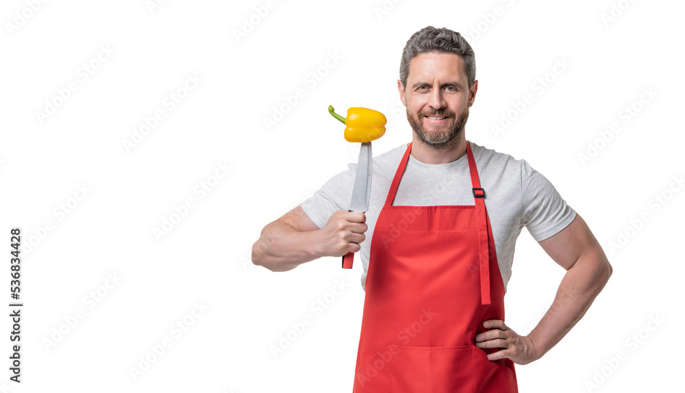 greengrocer man in apron with sweet pepper vegetable and knife isolated on white. copy space greengrocer man in apron with sweet pepper vegetable and knife isolated on white. copy space