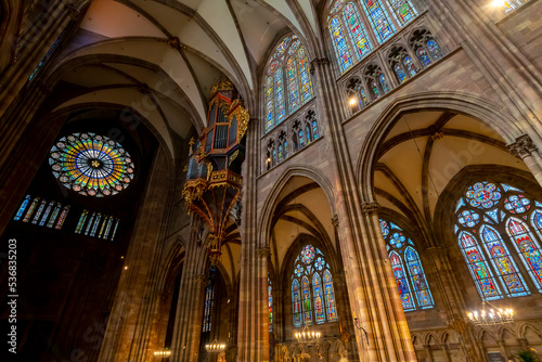 The interior nave, narthex, rose window, pillars and stained glass windows of the Our Lady of Strasbourg or Cathédrale Notre Dame de Strasbourg cathedral, in Strasbourg, France. photo
