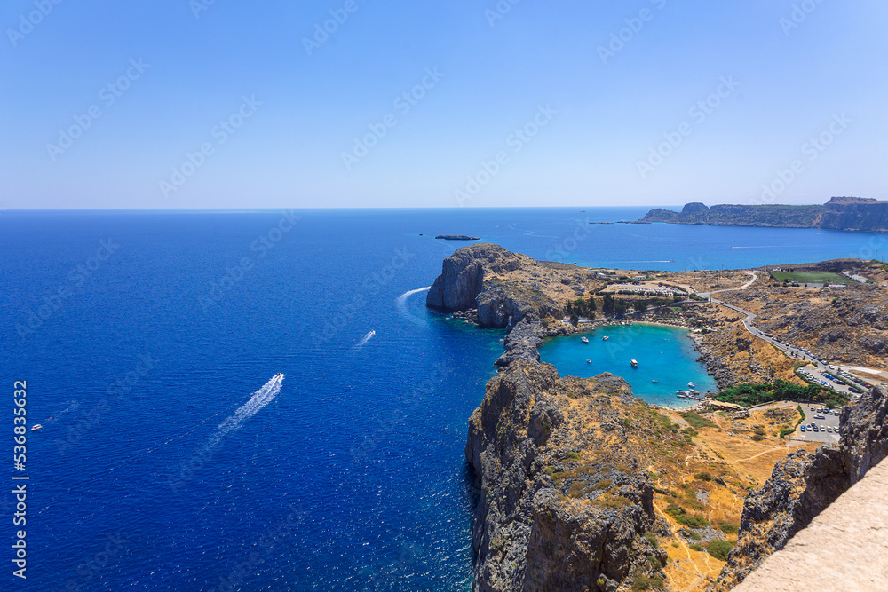 Panoramic view of Saint Pauls Bay in shape of heart from Acropolis of ancient city of Lindos, Rhodes, Greece. High quality photo