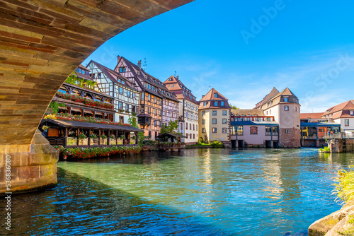 Quadro su tela Colorful half timber buildings of shops and cafes line the canals in the Petite-France area of Strasbourg, France, in the Northeast Alsace region
