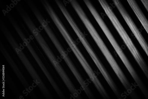 texture of a plank of wood. dark monochrome textured backdrop. Gray modern 