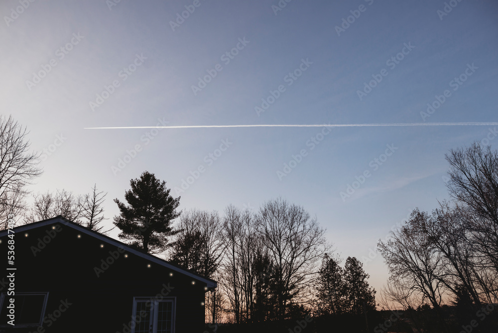 Plane across the sky at dusk