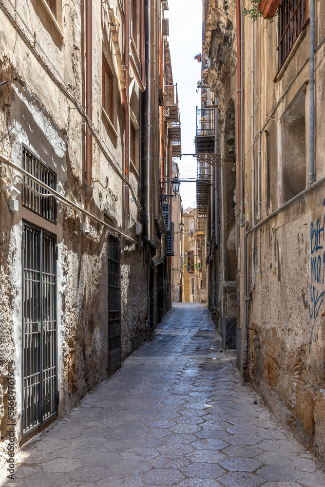 Palermo, Sicily, Italy - July 6, 2020: Typical Italian street and buildings in the old town of Palermo, Sicily, Italy.