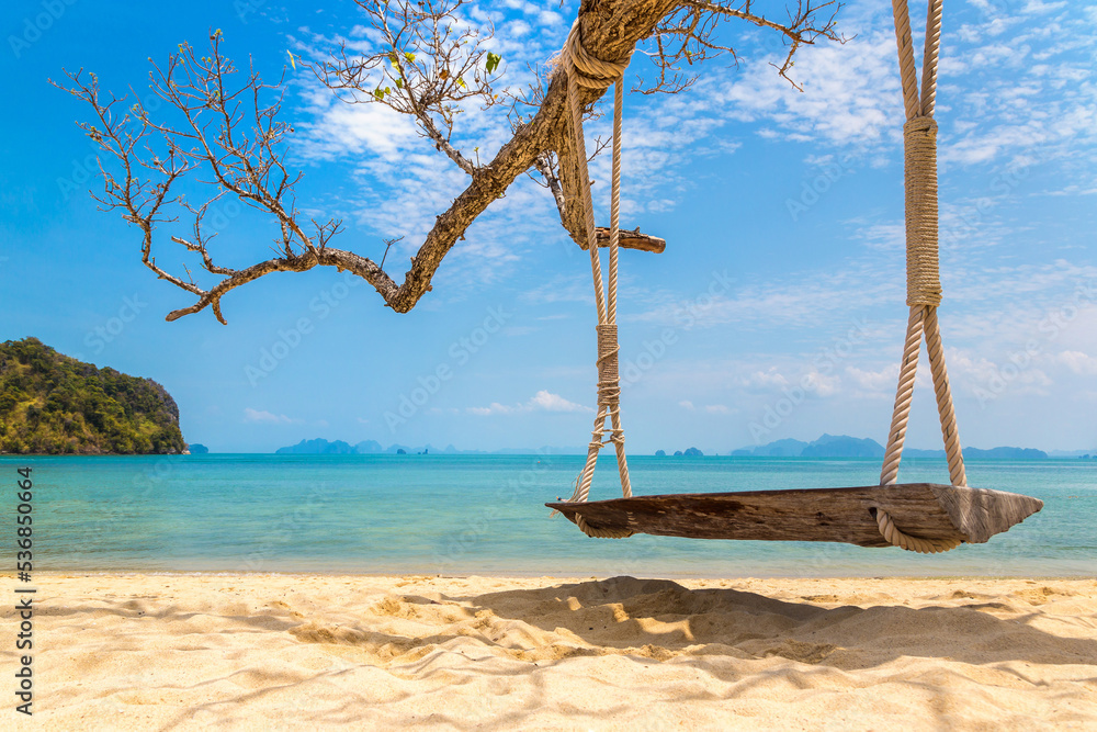 Empty swing at tropical beach Empty swing at tropical beach
