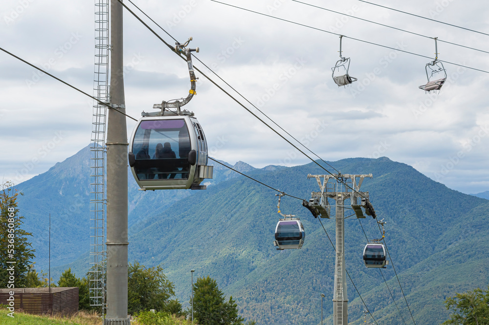 lifts of the mountain cable car on the background of mountains