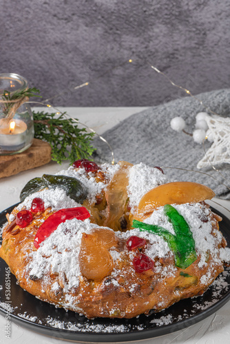 Wall Mural Bolo Rei or King's Cake is a traditional Xmas cake with fruits raisins nut and icing  on kitcthen countertop