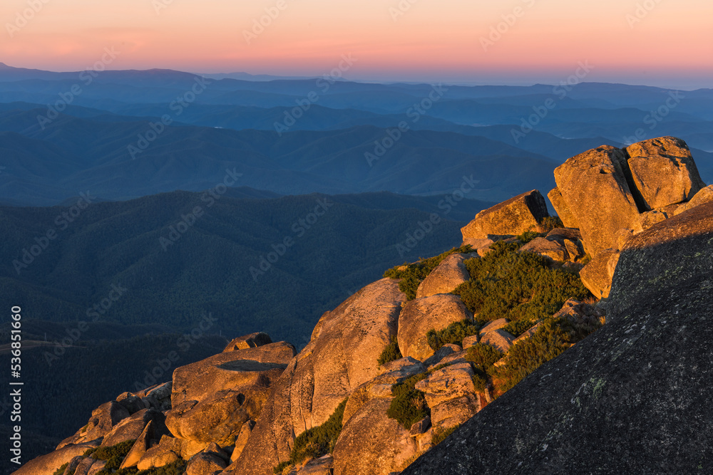 First light hits the side of Mount Buffalo in Victoria's high country