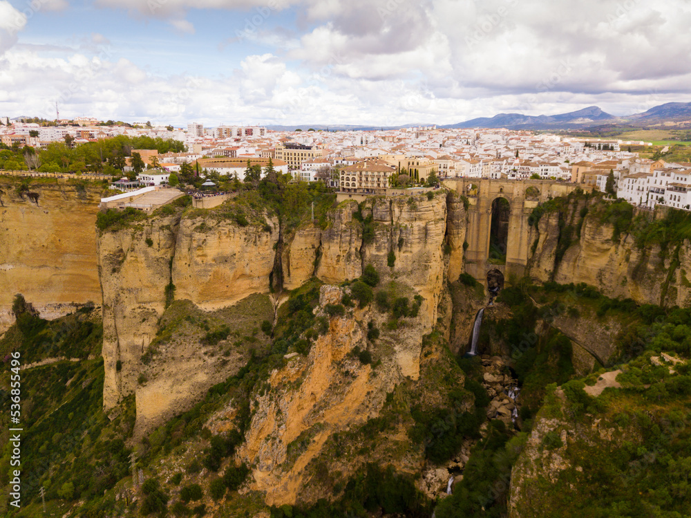 Fototapeta premium Aerial view of Ronda landscape and buildings with Puente Nuevo Bridge, Andalusia, Spain