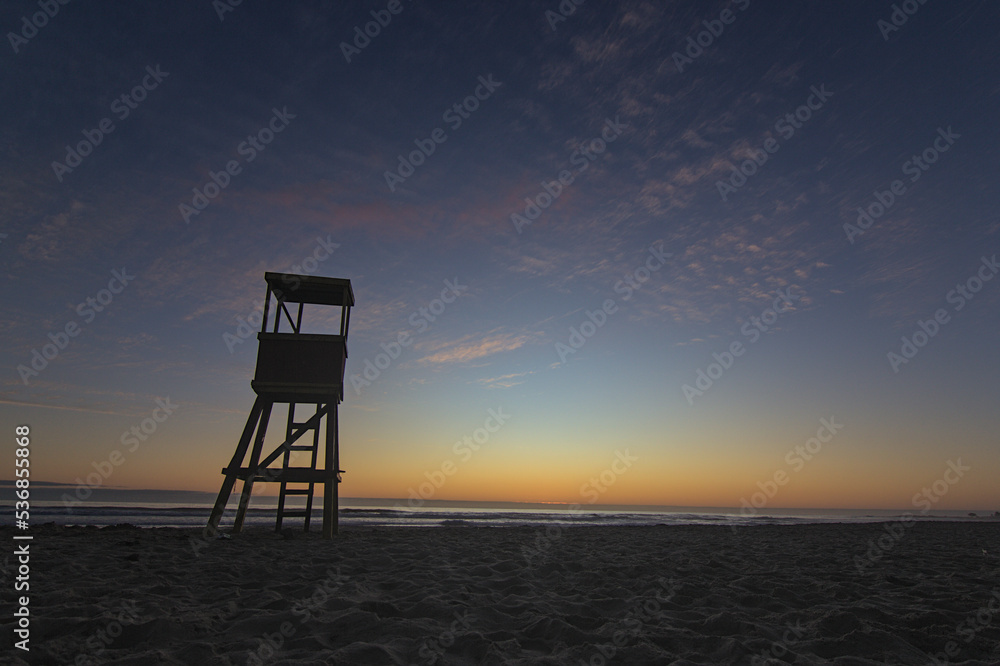 blue hour on the beach, sunset with wooden lifeguard hut
