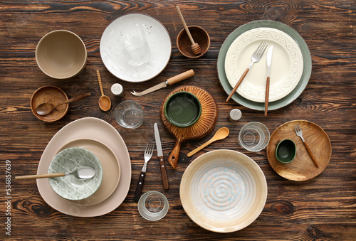 Photos Many different tableware on wooden background, top view