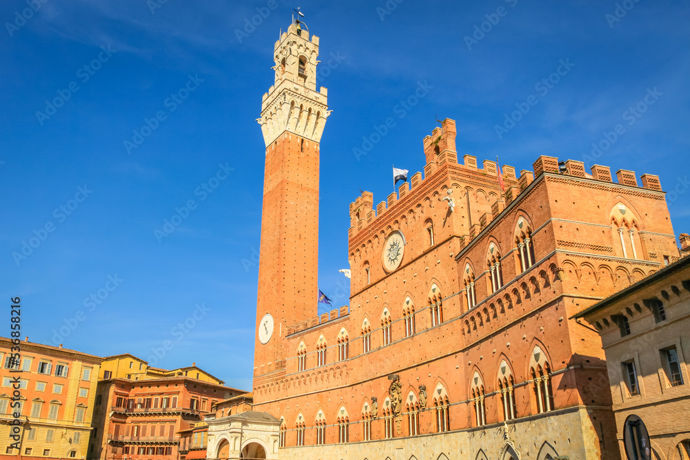 Medieval old town of Siena Piazza del Campo square at sunset, Tuscany, Italy