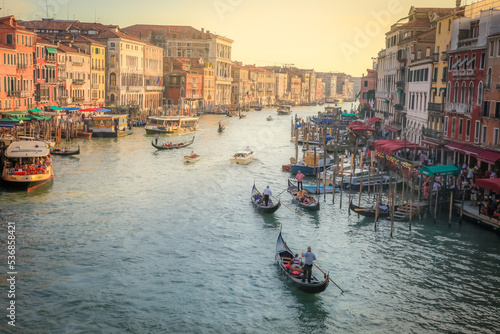 Ornate Gondolas in Grand Canal at golden sunset, Venice, Italy