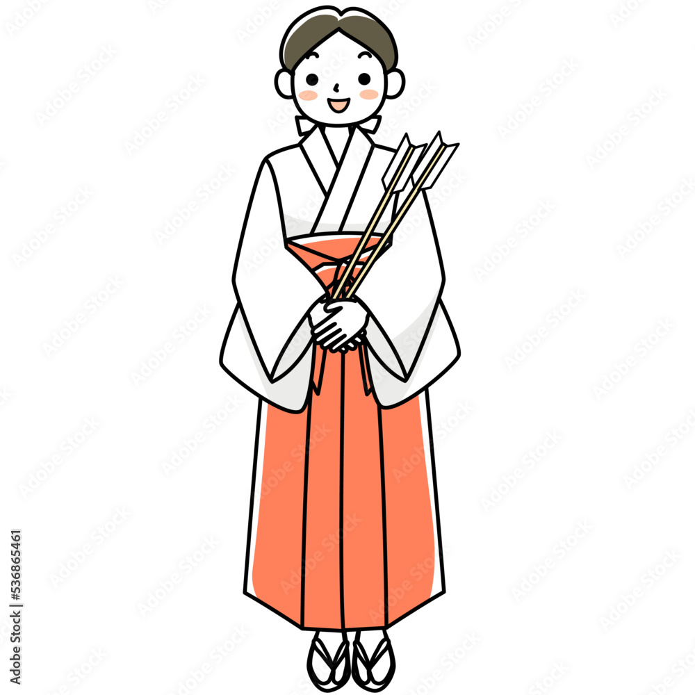 破魔矢を持つ立ち姿の笑顔の巫女さん