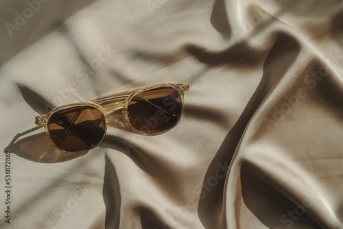 Modern design light brown sunglasses in natural sunlight.