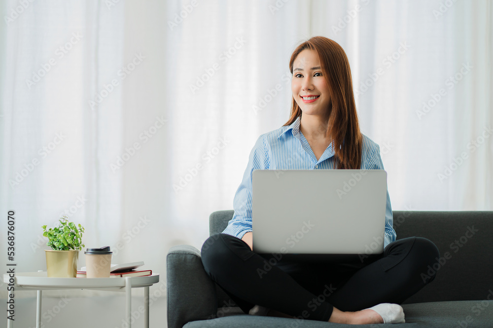 Asian businesswoman using laptop Communicate over the Internet with customers at home. online work from home concept Asian businesswoman using laptop Communicate over the Internet with customers at home. online work from home concept