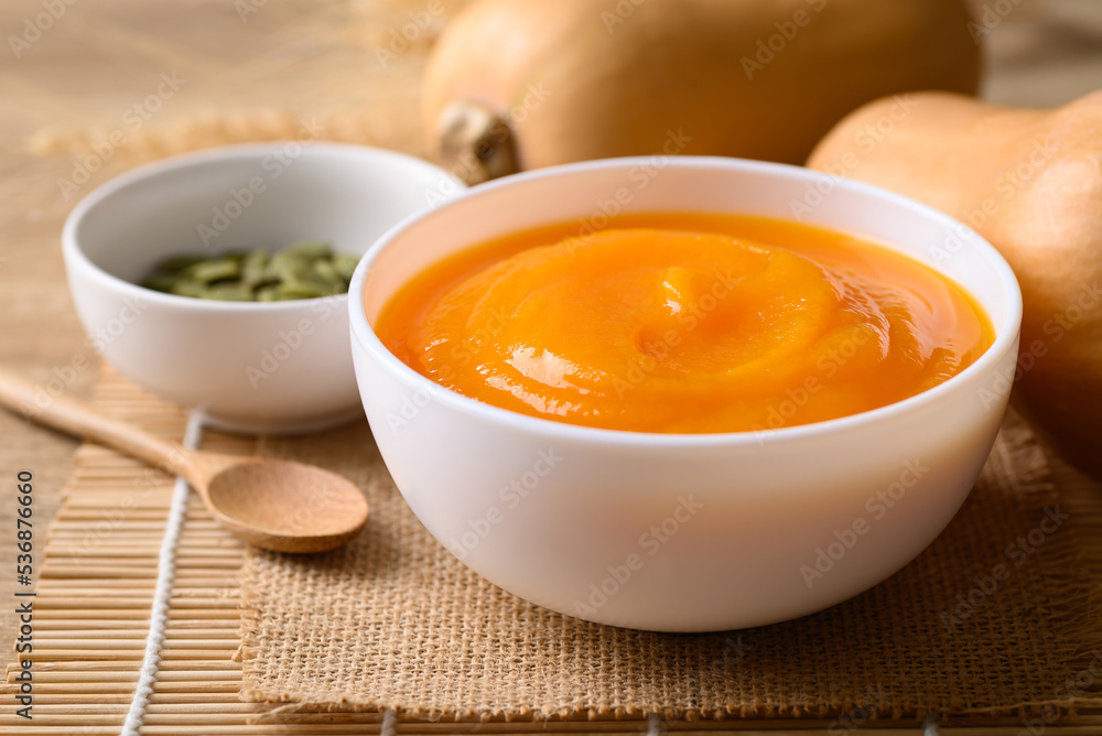 Butternut squash pumpkin soup in bowl, Homemade food in autumn season Butternut squash pumpkin soup in bowl, Homemade food in autumn season