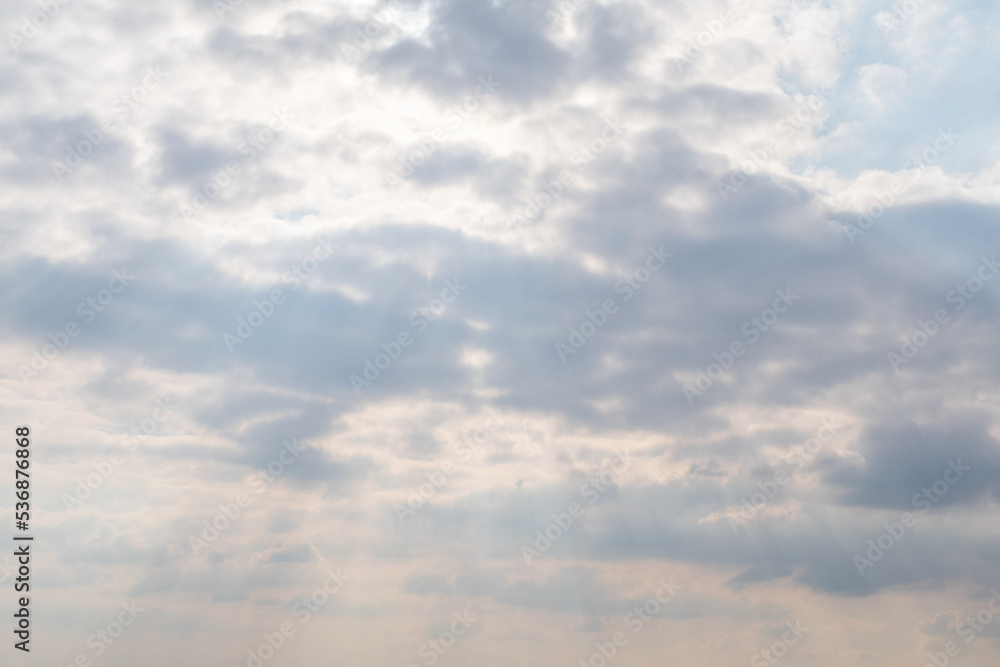 The faint sunlight seen through the clouds. The faint sunlight seen through the clouds.