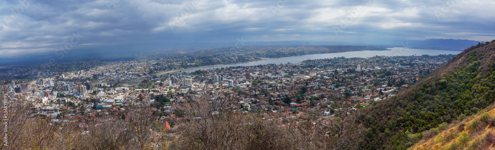 Cityscape of Villa Carlos Paz, Cordoba. Taken from the top of a hill on a clouded sky morning     