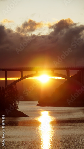 Sunset landscape from the San Roque dam, looking to a large bridge and the last minutes of  sunlight in Villa Carlos Paz , Cordoba 