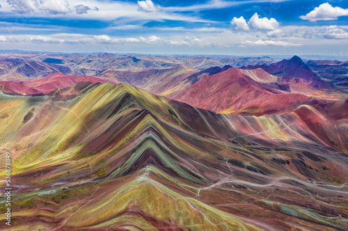 Aerial view of the entire Rainbow Mountains in Peru with Vinicunca in the center and the Red Valley in the background. photo
