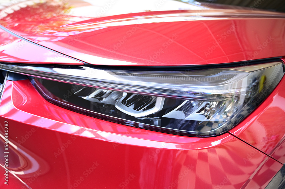 headlight of red car, transportation industry headlight of red car, transportation industry
