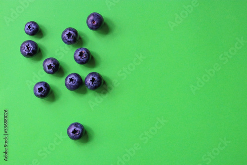 blueberries on green background