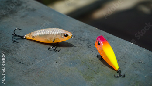 Artificial lure made from plastic for fishing by casting. Selected focus of casting lure with hook - Artificial lure with the shape of minnow