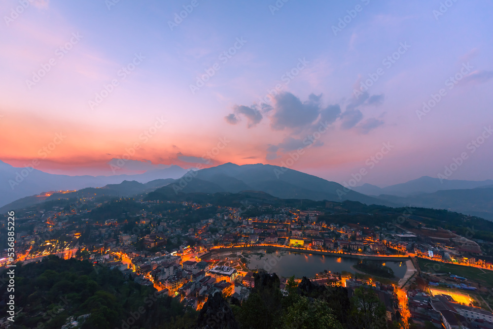 Beautiful landscape view from the top of Mount Hamrong in Sapa city at sunset. Sapa is a famous scenery city in Lao Cai Province in northwest Vietnam, Travel concept.