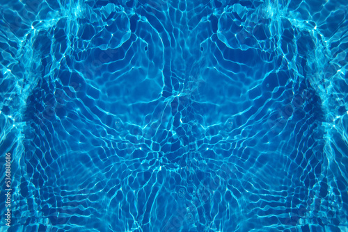 Defocus blurred transparent blue colored clear calm water surface texture with splash  bubble. Shining blue water ripple background. Surface of water in swimming pool. Blue bubble water shining.