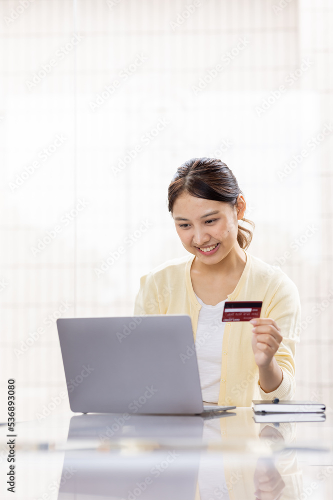 Online payment, Asian girl, using smartphone and laptop holding credit card for online shopping
Online payment, Asian girl, using smartphone and laptop holding credit card for online shopping