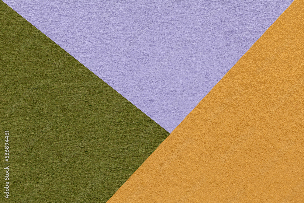 Fototapeta premium Texture of craft yellow, green and lilac shade color paper background, macro. Vintage abstract cardboard