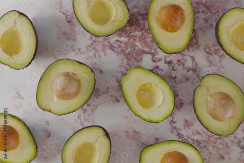 Avocados view from above on a marble surface