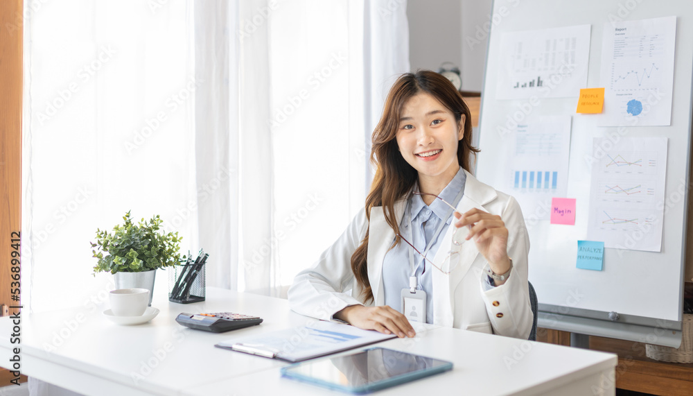 Office worker with a beautiful Asian woman in a private office, Daily routine of office workers, Welcome to work in the morning with a bright smile, Businesswoman in office concept. Office worker with a beautiful Asian woman in a private office, Daily routine of office workers, Welcome to work in the morning with a bright smile, Businesswoman in office concept.