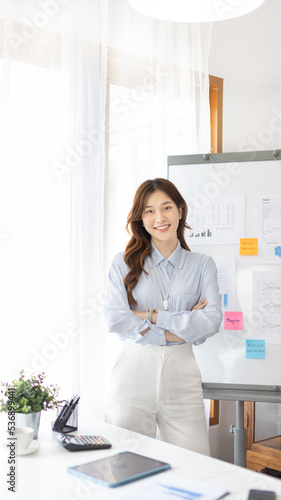 Office worker with a beautiful Asian woman in a private office, Daily routine of office workers, Welcome to work in the morning with a bright smile, Businesswoman in office concept.