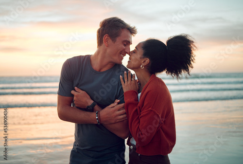 Canvas Print Love, beach and couple kiss at sunset, happy and bonding on their summer vacation in Florida