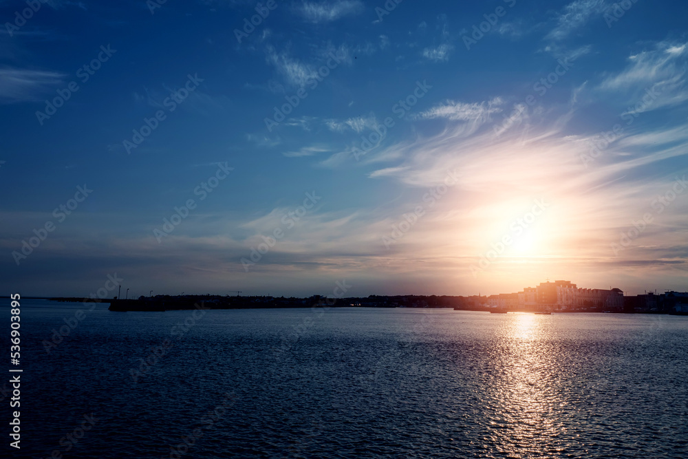 Silhouette of Galway city at sunset. Blue and warm tone. Nimmo's Pier and the Long Walk area. Silhouette of Galway city at sunset. Blue and warm tone. Nimmo's Pier and the Long Walk area.
