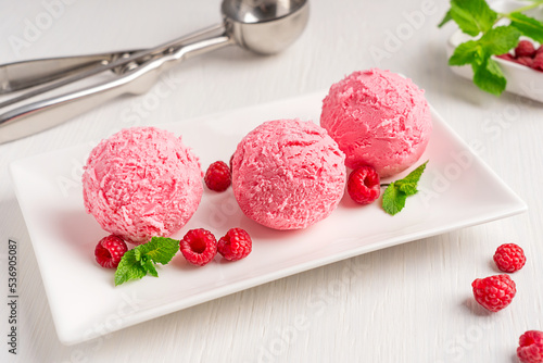 Valokuva Three scoops of sweet homemade berry ice cream or refreshing sorbet of pink colo