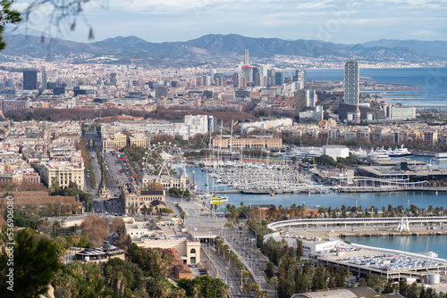 View of Barcelona Cityscape and sea shore with mountains on background. Vacation and travel concept © Hladchenko Viktor