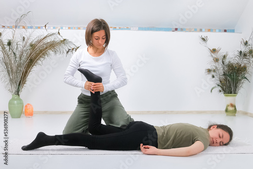 Teenager getting Shiatsu massage from Shiatsu masseuse