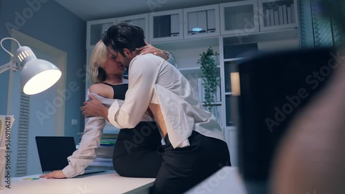 Caucasian businessman and woman foreplay and making love in the office