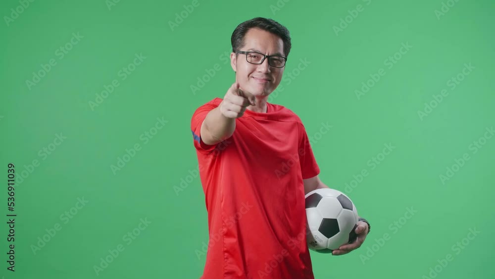 Asian Man With A Ball Putting Hand On His Chest And Pointing Forward While Cheering Soccer On Green Screen Background
Asian Man With A Ball Putting Hand On His Chest And Pointing Forward While Cheering Soccer On Green Screen Background