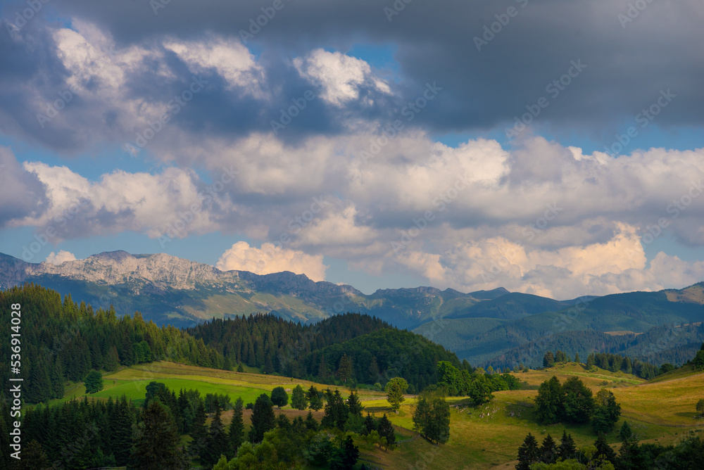 Obraz premium Mountain landscape with clouds