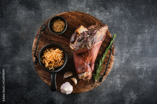 Photography Smoked pork knuckle with stewed cabbage and spices