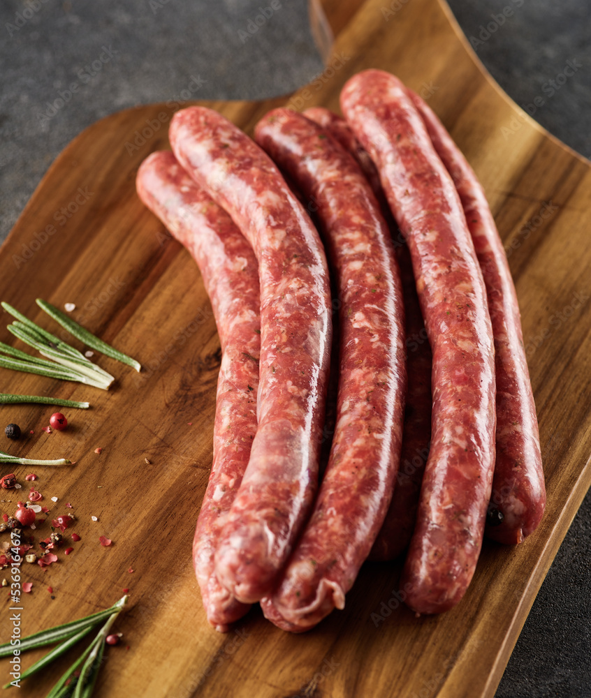 Raw Beef bratwurst. German sausages. Rinderbratwurst. Fresh raw beef sausages. Close up. Raw Beef bratwurst. German sausages. Rinderbratwurst. Fresh raw beef sausages. Close up.