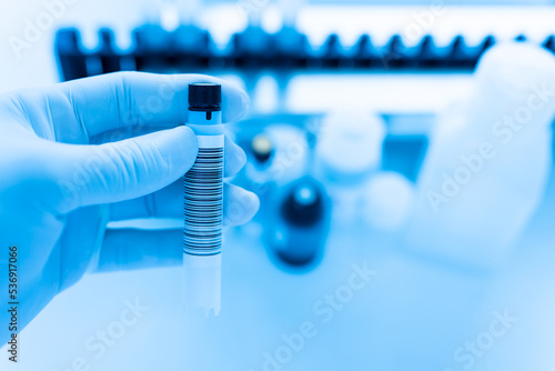 Reagent tubes and bottes for laboratory analysis automate machine.Sample specimen in test tube and chemistry and immunology reagent bottle .Conceptual image COVID-19 test tube sample. photo