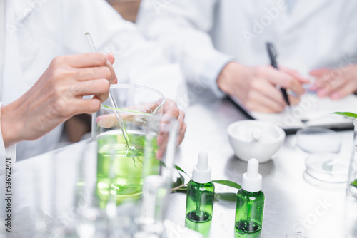 chemistry scientist working on biotechnology cosmetic research with natural herb medicine ingredient in biology science laboratory, organic bio eco beauty extract in botany experiment for dermatology